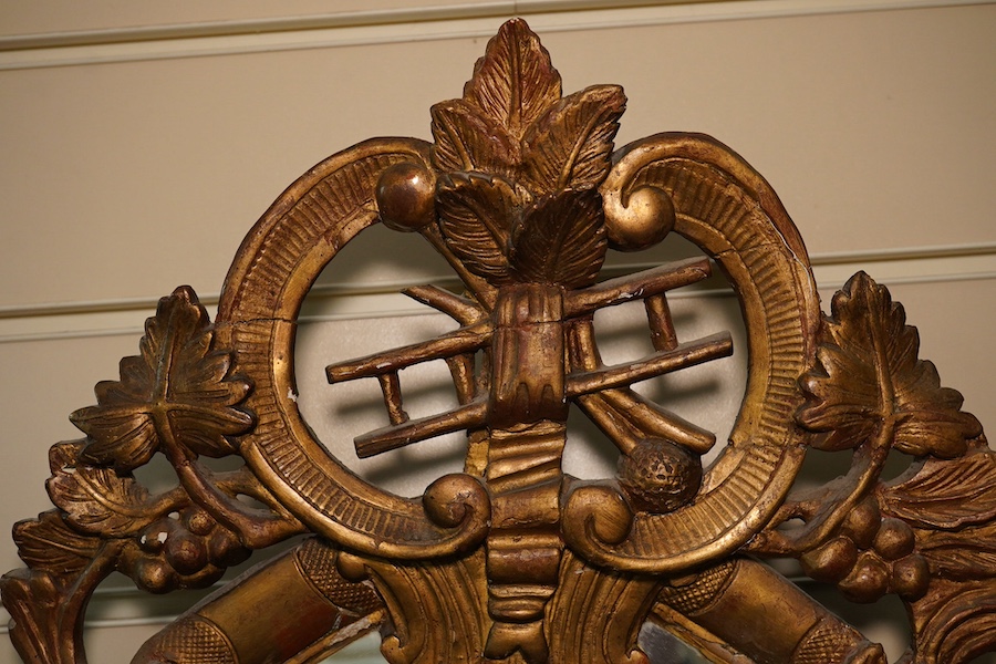 A Victorian gilt gesso mirror with chimney sweep's guild crest. Condition - poor to fair